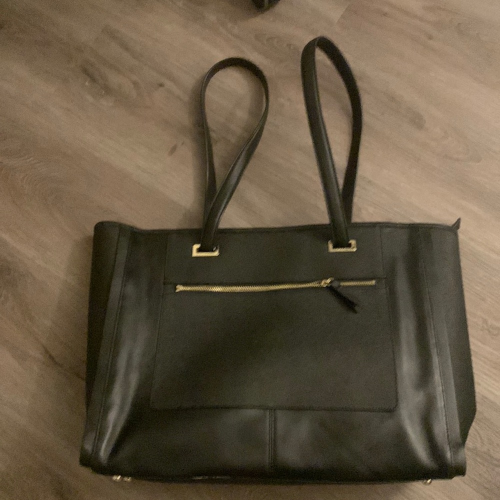 Black Lo & Sons Seville Prima leather tote bag.